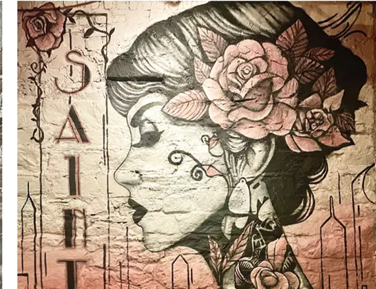 Finished Saint mural on the same wall
