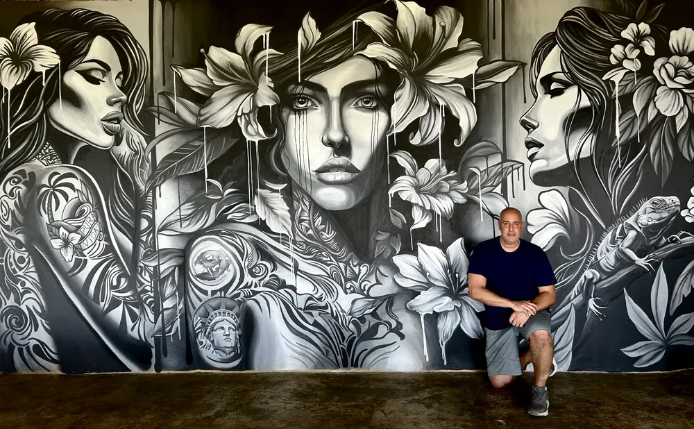 Black-and-white floral feature wall at Casa Lamia Resort, Costa Rica, with the artist